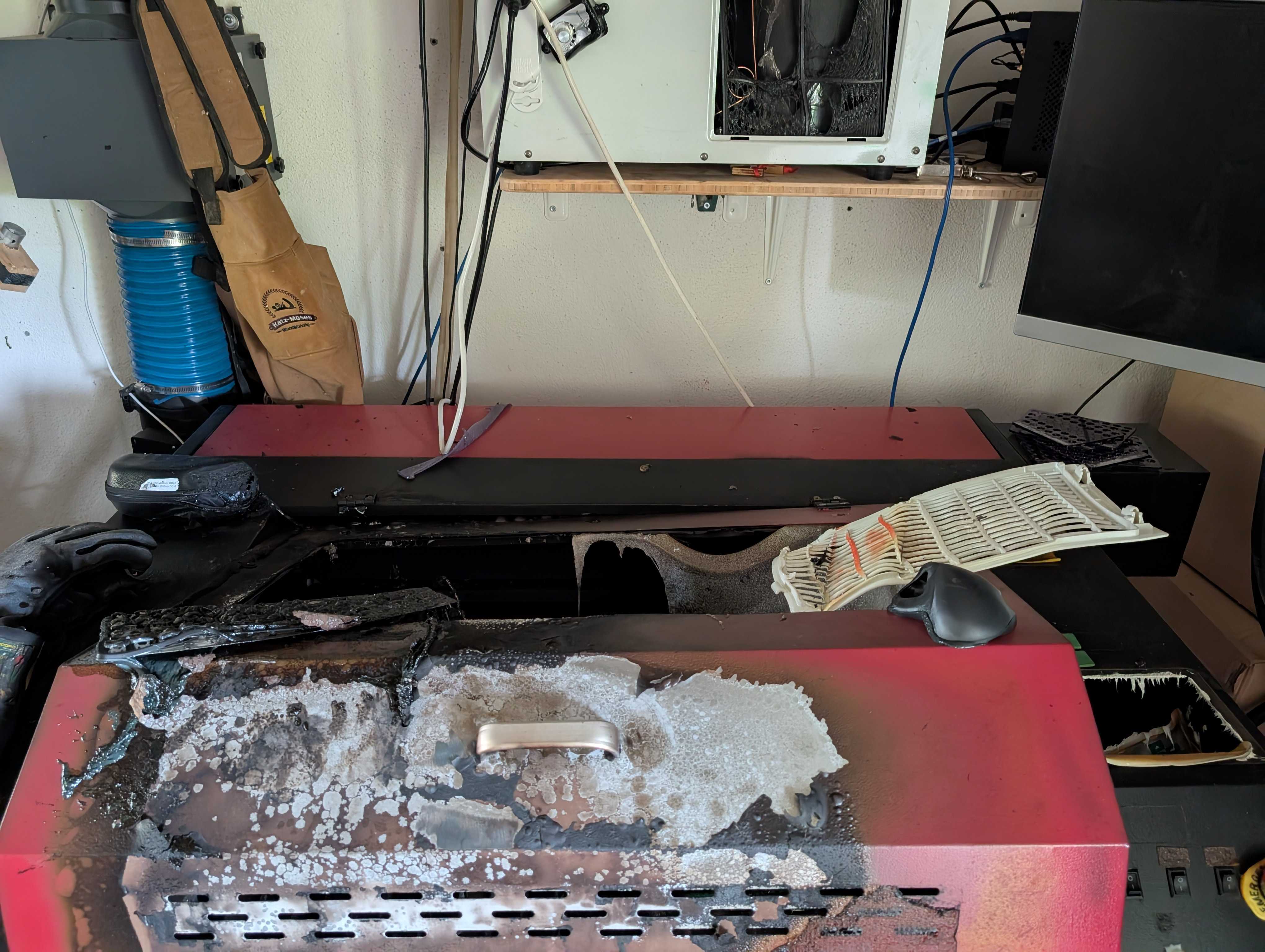 Photo of a burned and destroyed laser, after the fire was extinguished