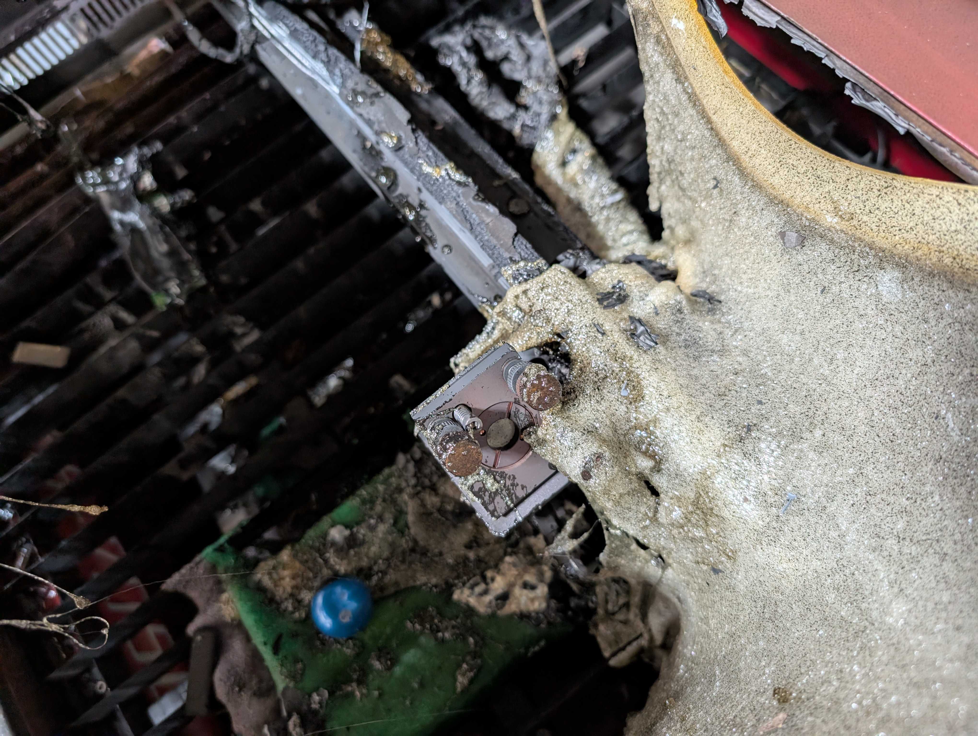 Photo of the burned and melted components inside the laser